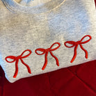 Embroidered 3 Bow sweatshirt-Graphic Tee- Simply Simpson's Boutique is a Women's Online Fashion Boutique Located in Jupiter, Florida