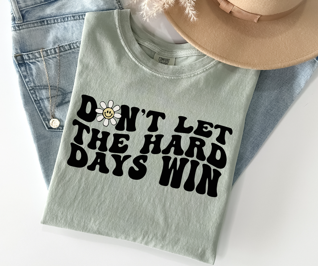 Don't Let the Hard Days Win Graphic Tee-Graphic Tee- Simply Simpson's Boutique is a Women's Online Fashion Boutique Located in Jupiter, Florida